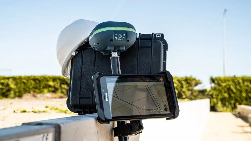 Surveyor using the UNI-Collect app on a tablet in the field